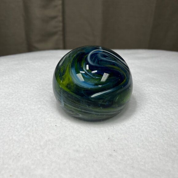 Clear glass round paperweight with blue and green swirls - Picture 3 of 7